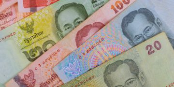 Close up of thailand currency, thai baht with the images of Thailand King.