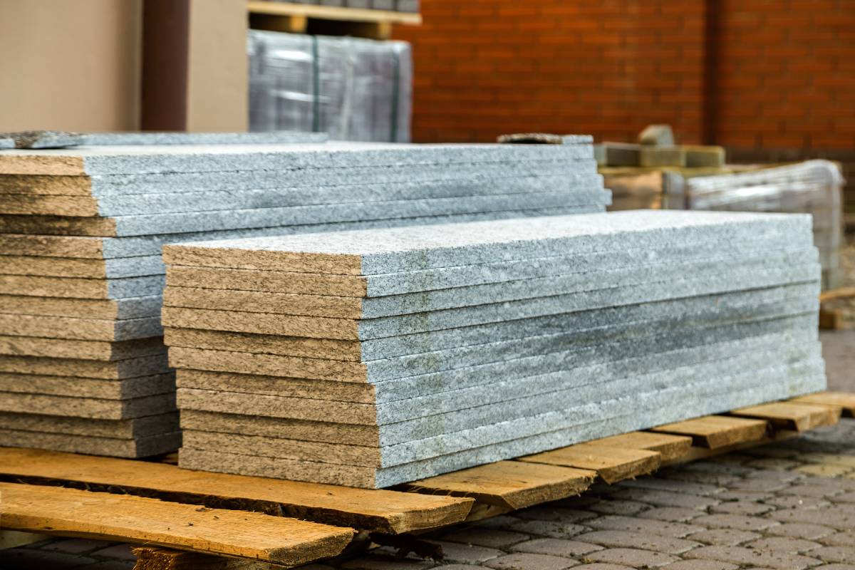 Piles of granite marble slabs.  Stone sheets for decorative construction.